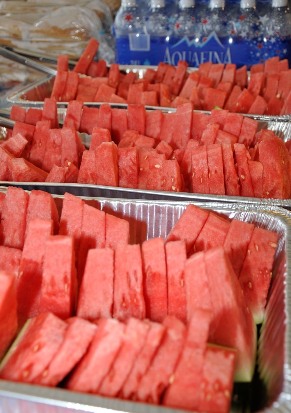 Ice cold watermelon helped cool families during All American BBQ at Oasis Pool and Water Park, aboard Marine Corps Logistics Base Barstow, Calif., July 4