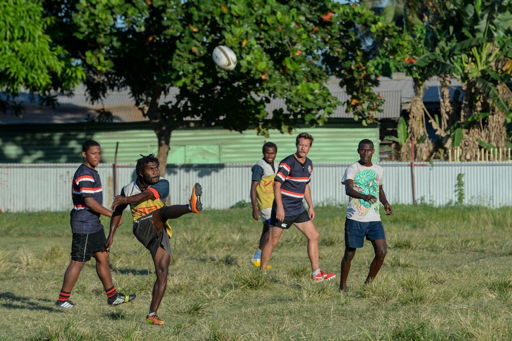 USNS Mercy rugby team practices with Rabaul Redskins during Pacific Partnership 2015