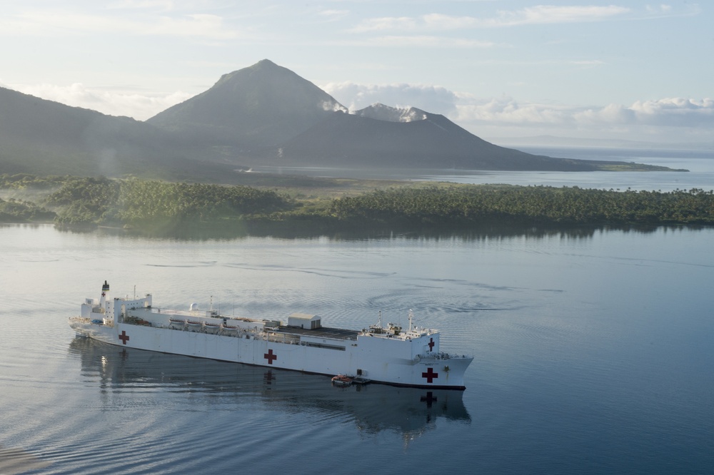 Mercy sits at anchorage in Simpson Harbor in Rabaul during Pacific Partnership 2015