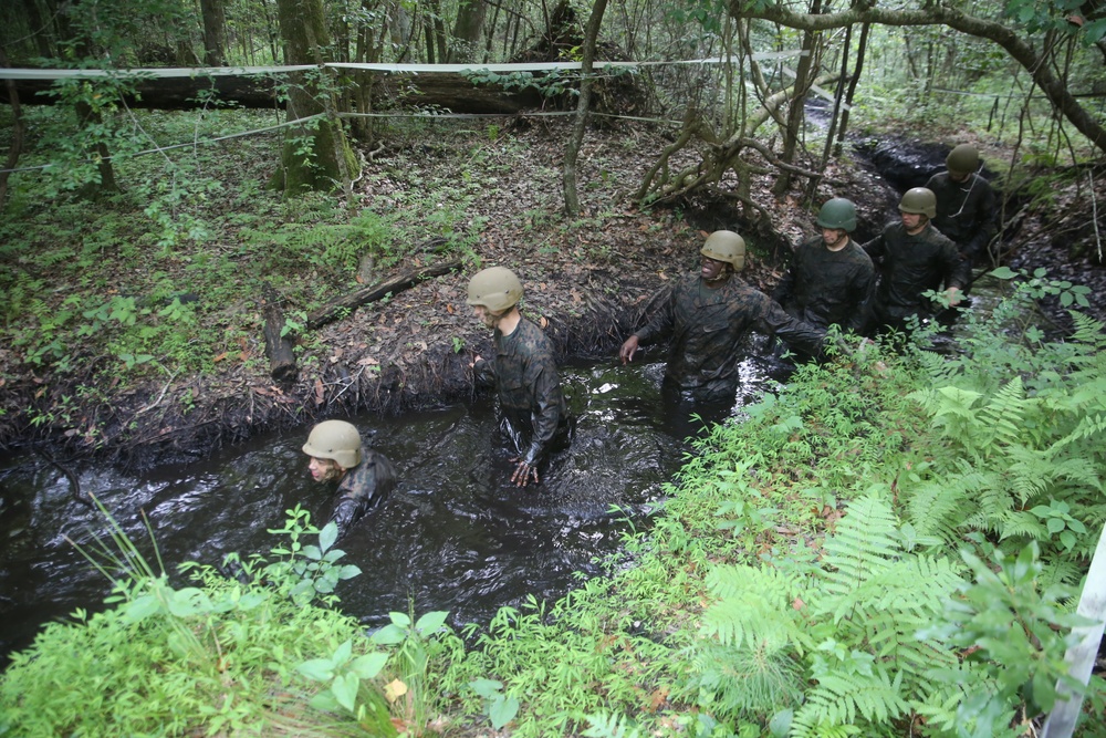 Service Company conquers endurance course obstacles, swamps