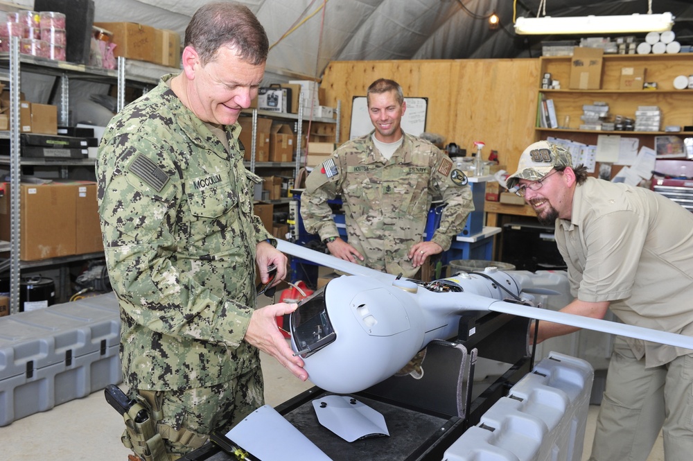 Vice Commander, US Naval Forces Central Command, examines ScanEagle imaging system at Kandahar Airfield June 25, 2015