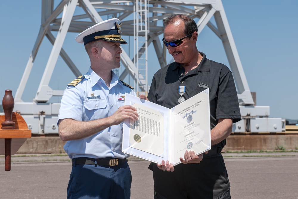 Coast Guard awards Silver Lifesaving Medal for heroic rescue in Duluth Harbor in 2013