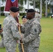 Command Sgt. Major Wrighton passes Col. Ackermann the colors
