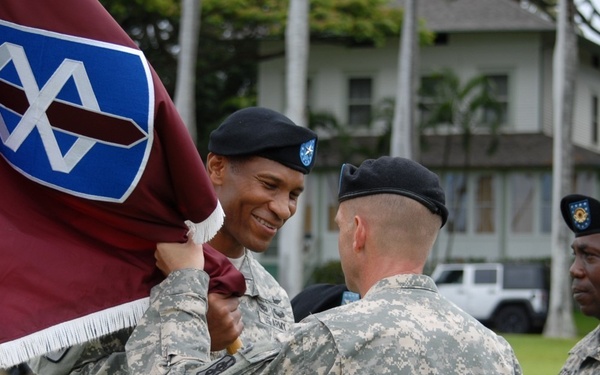 Col. Ackermann passes the 18th MEDCOM colors to Brig. Gen. Sargent