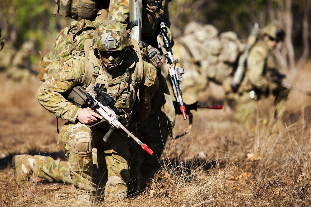 Australian Army soldiers set up a perimeter after a tactical insertion as part of an amphibious assault during Talisman Sabre 2015
