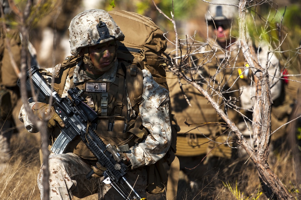U.S. Marines set up a perimeter after a tactical insertion as part of an amphibious assault during Talisman Sabre 2015