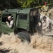 U.S. Marines work together to push a M151 jeep out of the sand during Talisman Sabre 2015