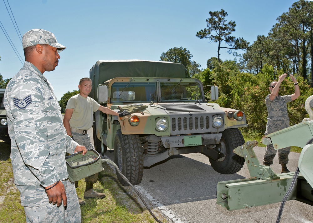 290th vehicle maintenance technicians collect downed Humvee