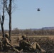 Australian soldiers and U.S. Marines air assault through a mock enemy objective