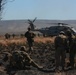 Australian soldiers and U.S. Marines air assault through a mock enemy objective