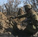 Australian soldiers and U.S. Marines air assault through a mock enemy objective