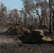 Australian soldiers and U.S. Marines air assault through a mock enemy objective