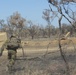 Australian soldiers and U.S. Marines air assault through a mock enemy objective