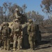 Australian soldiers and U.S. Marines air assault through a mock enemy objective