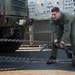 US Sailor secures equipment and cargo onto a Landing Craft Air Cushion vehicle during Talisman Sabre 2015