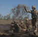 Australian soldiers and U.S. Marines air assault through a mock enemy objective