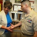 Presenting and receiving of coins a priceless commodity for Navy Nurse Corps officer