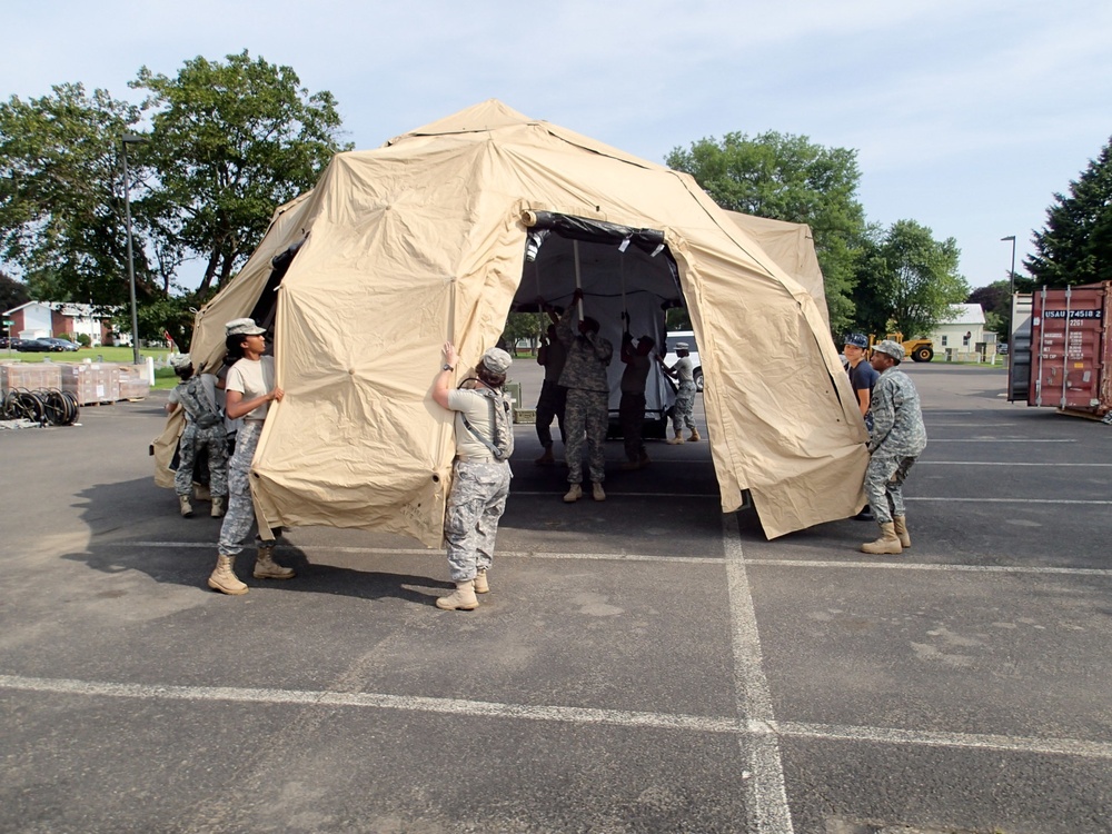 Service members prepare tents for IRT mission