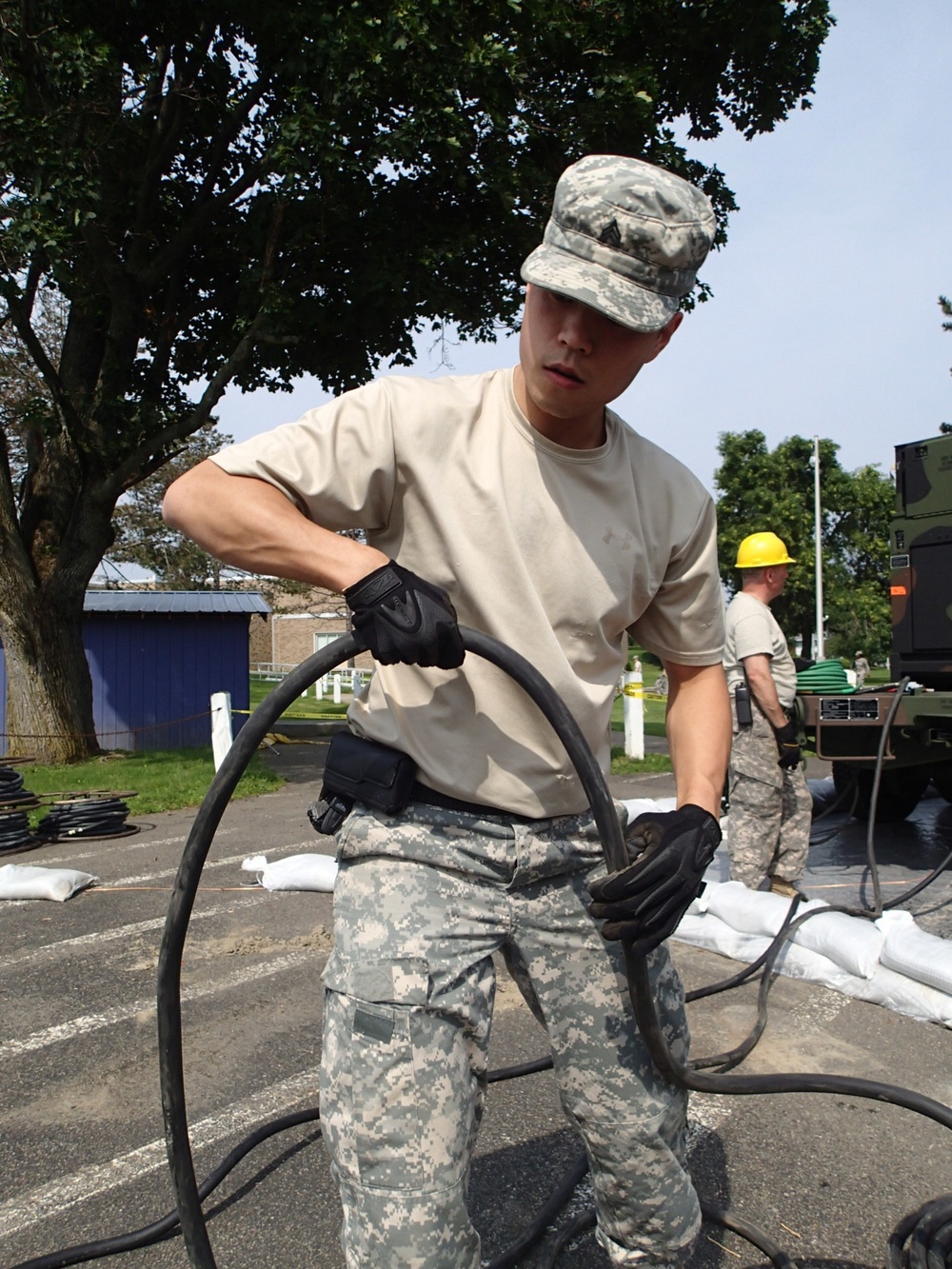 Soldiers connects electrical equipment for IRT in Norwich, NY