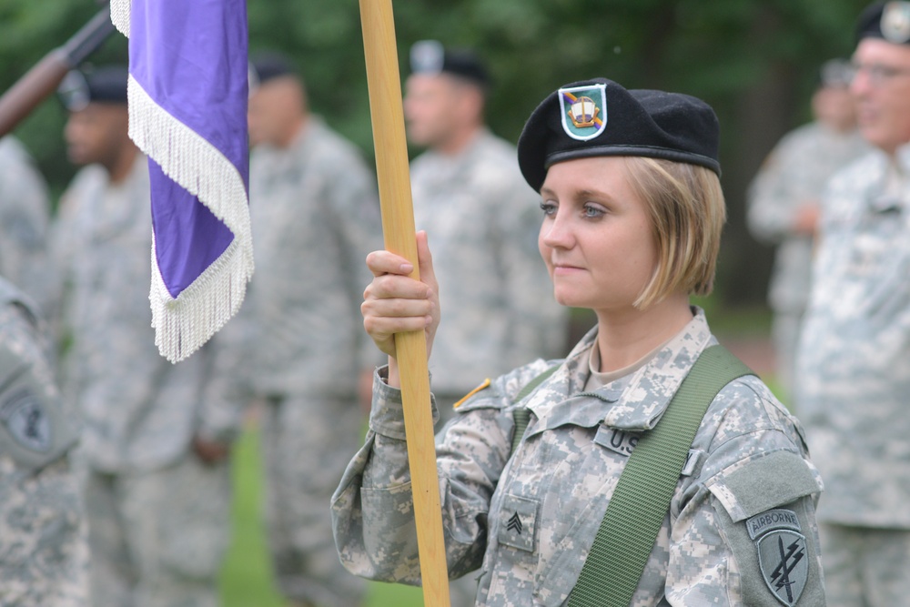 Soldier holds guidon at Cantigny Park ceremony