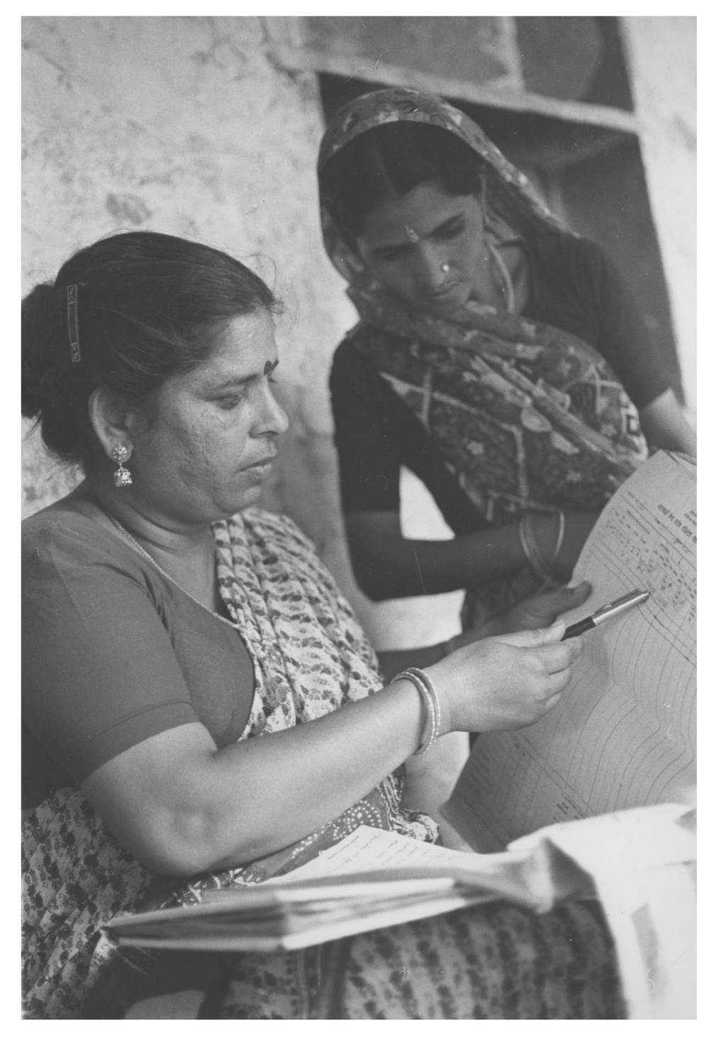 A government of India child development program officer reviews records