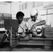 Trainees operating an engine lathe