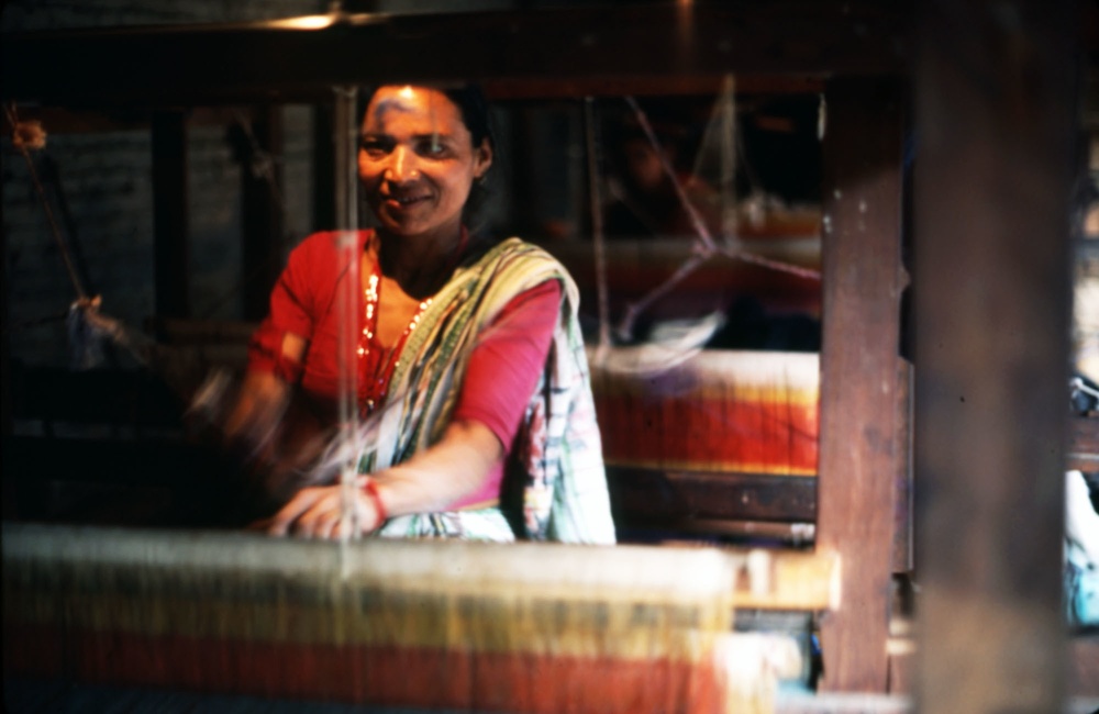 Woman operating loom in Nepal