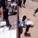 Workers unload food supplies from USAID truck