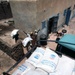 Workers unload food supplies from USAID truck