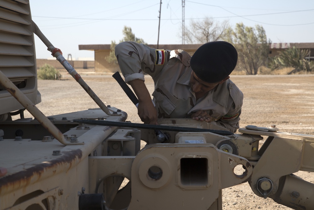 Iraqi Army Soldiers train on mine sweeping and vehicle maintenance