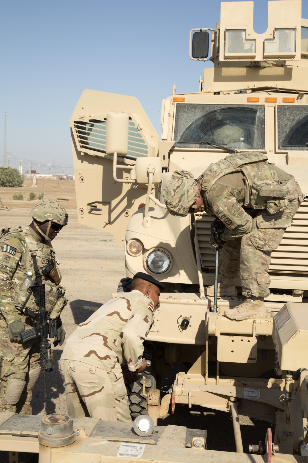 Iraqi Army IA Soldiers train on mine sweeping and vehicle maintenance