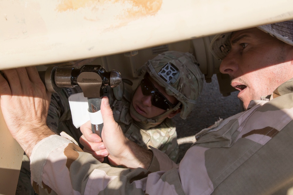 Iraqi Army Soldiers train on mine sweeping and vehicle maintenance