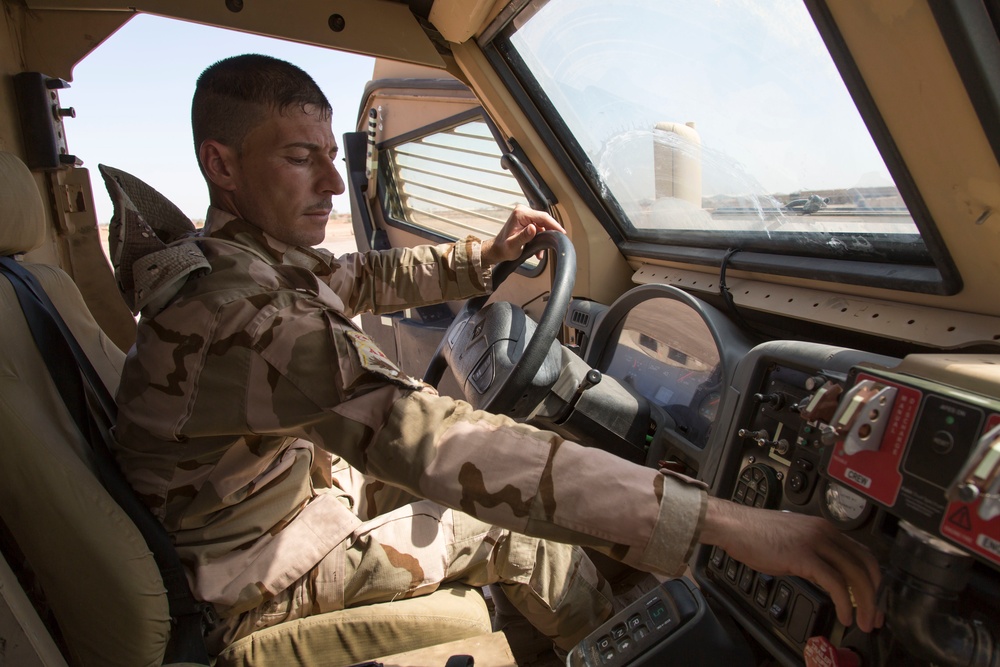 Iraqi Army Soldiers train on mine sweeping and vehicle maintenance