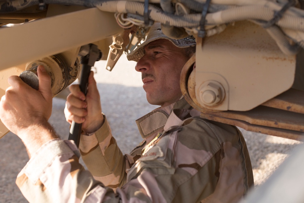 Iraqi Army Soldiers train on mine sweeping and vehicle maintenance