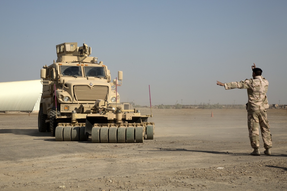 Iraqi Army Soldiers train on mine sweeping and vehicle maintenance