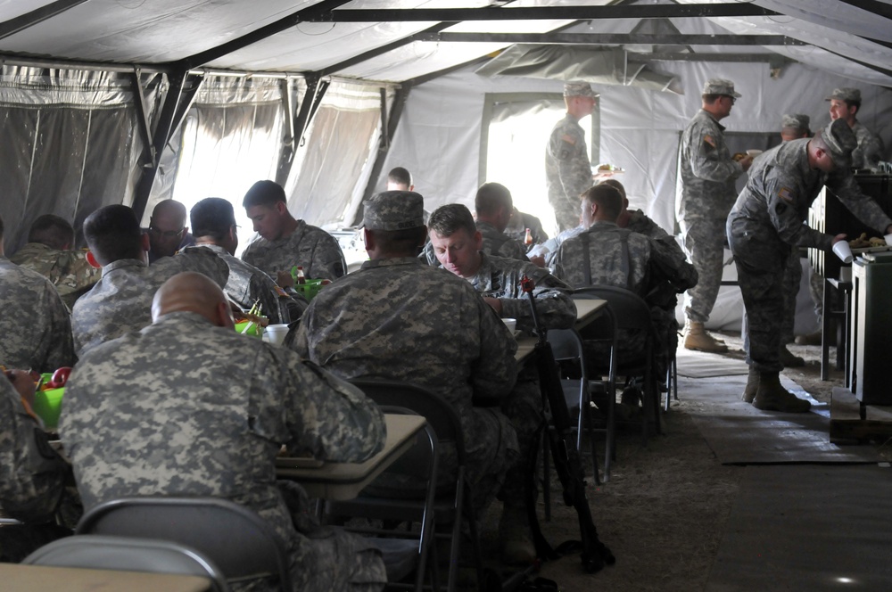 Army Reserve Soldiers eat chow during cooking competition