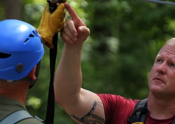 Marines soar through trees during Operation Adrenaline Rush