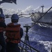 USS Chosin chiefs heave around a line