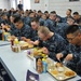 Navy recruits dine in the galley