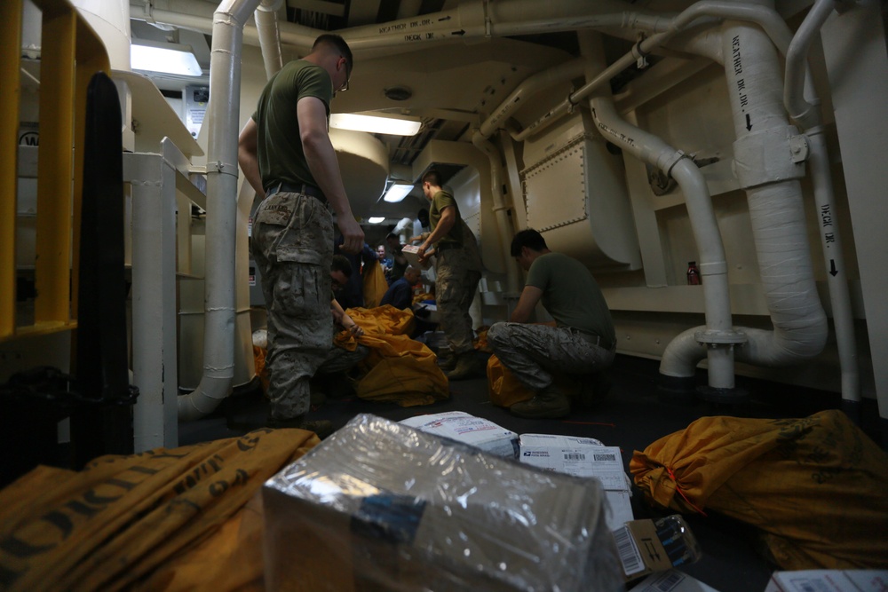 Mail call for U.S. Marines aboard USS Anchorage