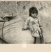 Girl sitting on a sack