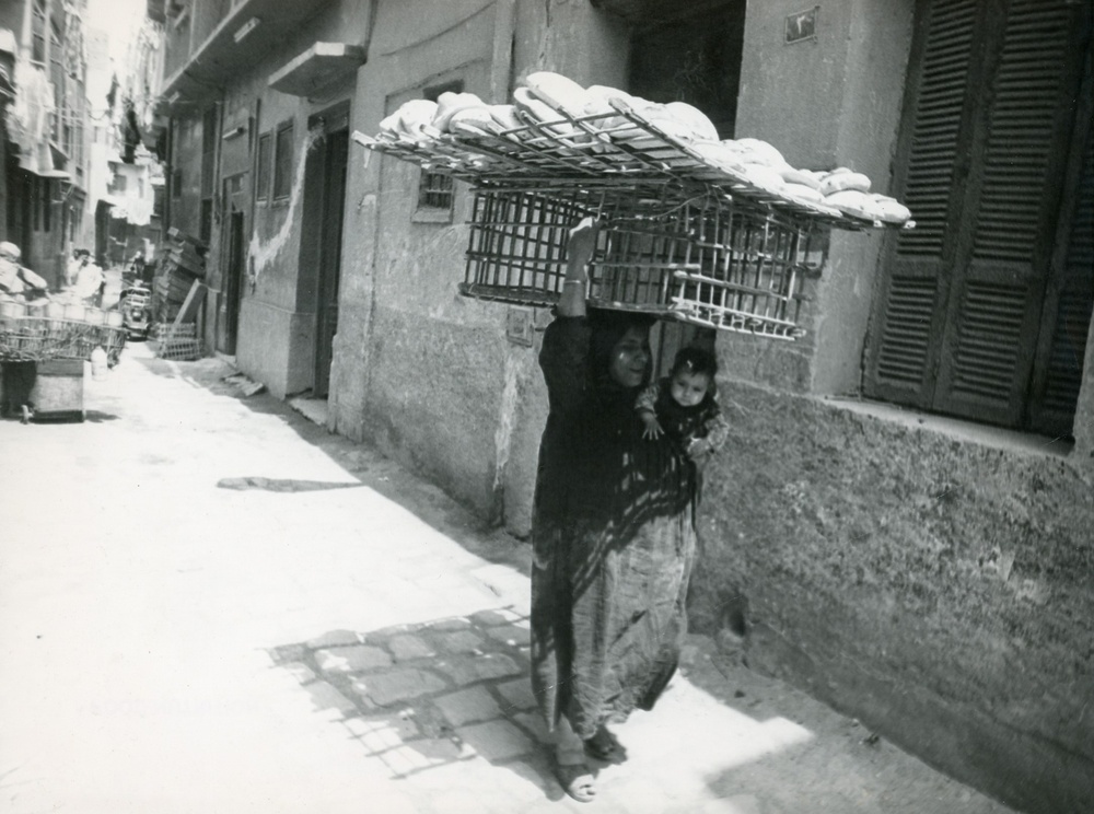Woman and girl transporting goods in Egypt