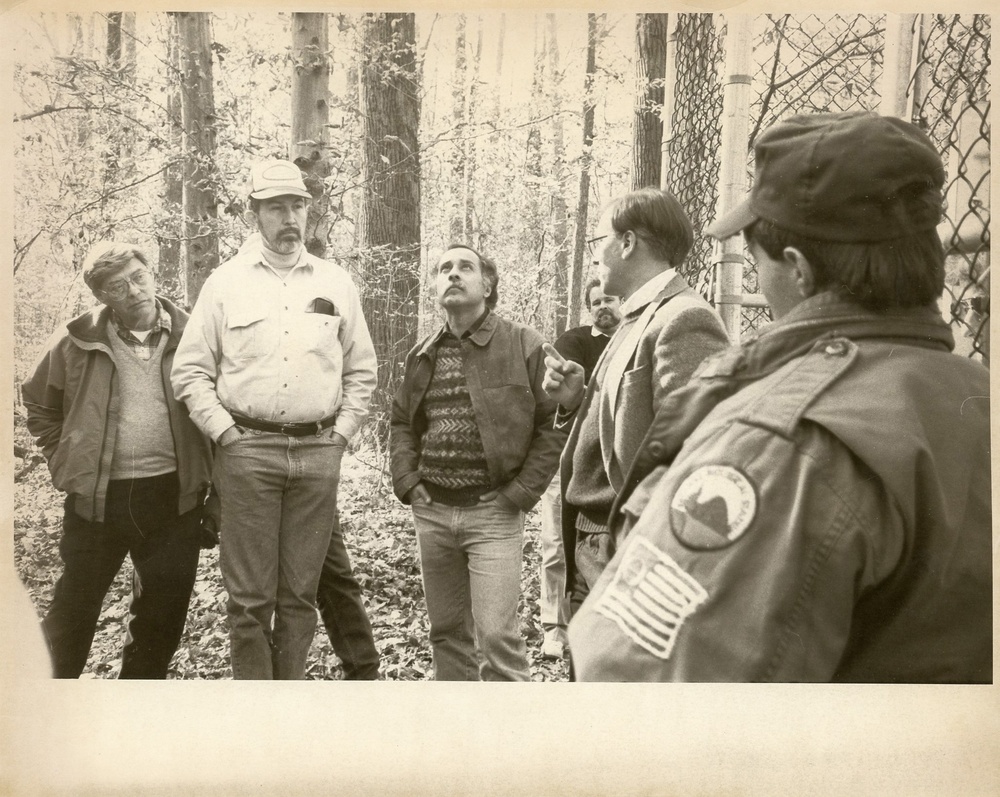 Men standing in the woods