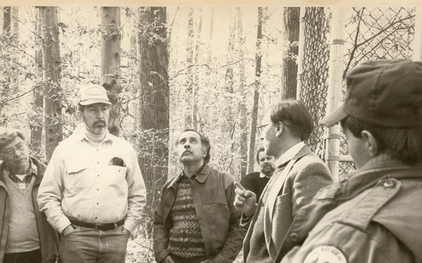 Men standing in the woods