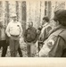 Men standing in the woods