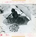 Boy under umbrella in the sun
