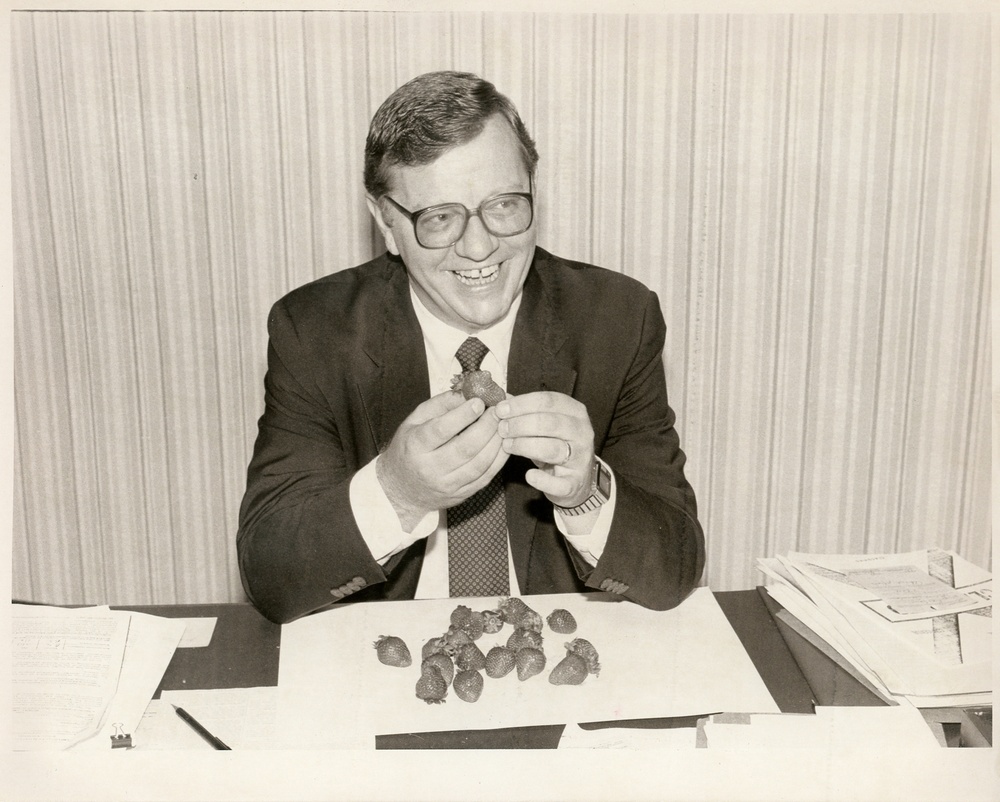 Man eating strawberries
