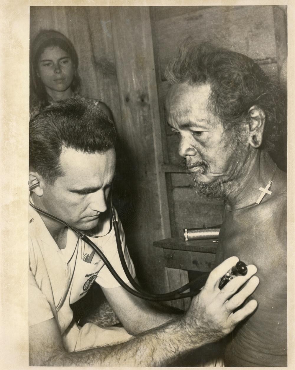 Doctor observing a patient