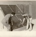 Men observing glass panes