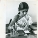 Woman working an IBM machine